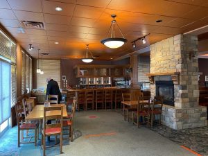 Interior of an existing casual dining restaurant before a MR MIKES restaurant conversion franchise update in Canada
