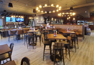 Renovated dining room inside a MR MIKES casual dining franchise after restaurant conversion in Canada